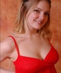 Danielle looks super cute and innocent in her red babydoll and black tight panties