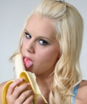Busty and horny blonde Jenny shows off her oral skills with a banana