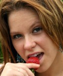 18 year old Kandie gets naked and enjoys some strawberrys in a park
